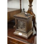 EARLY 20th CENTURY OAK CASED MANTLE CLOCK, the glazed door enclosing silvered plate with black Roman