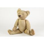 PRE-WAR GOLDEN PLUSH TEDDY BEAR in original but well-loved condition with stitched detail, swivel