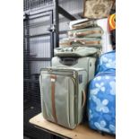 A SUITE OF SAMSONITE GREEN FABRIC SUITCASES, TO INCLUDE THREE GRADUATED SUITCASES AND FOUR BAGS (7)