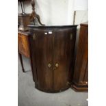 GEORGE III MAHOGANY BOW FRONTED HANGING CORNER CUPBOARD