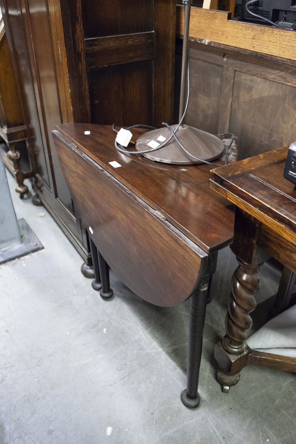 A MAHOGANY RECTANGULAR TABLE WITH SINGLE TRIANGULAR FALL LEAF