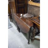 A MAHOGANY RECTANGULAR TABLE WITH SINGLE TRIANGULAR FALL LEAF