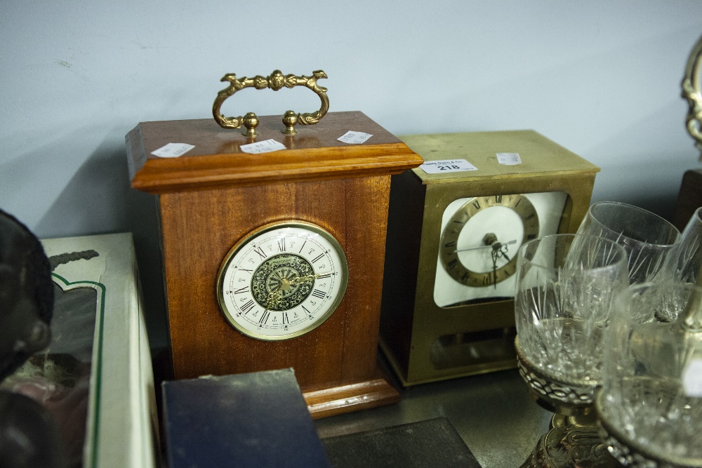 A MODERN BRASS MANTEL CLOCK AND ANOTHER IN OAK CASE