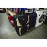 A SUITE OF FIVE GRADUATED 'SKYROAD' SUITCASES AND A LARGE PURPLE SUITCASE (6)