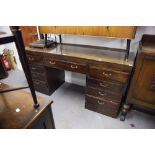 A TWENTIETH CENTURY MAHOGANY DOUBLE PEDESTAL DESK WITH NINE DRAWERS, ON PLINTH BASES, 5;6" X 1'8"