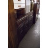 AN ORIENTAL DARK WOOD SIDEBOARD, THREE DRAWERS ABOVE THREE DOORS WITH DECORATIVE CARVED PANELS