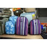 FIVE VARIOUS SIZED SUITCASES, TWO MATCHING SETS AND A JOHN LEWIS SUITCASE (5)