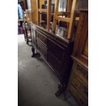 AN OAK SIDEBOARD WITH LEDGE BACK, TWO CENTRE DRAWERS, END CUPBOARDS ON CUP AND COVER SUPPORTS