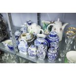 A QUANTITY OF BLUE AND WHITE POTTERY TO INCLUDE; JUGS, VASES, RACK PLATES, TEA POT ETC......