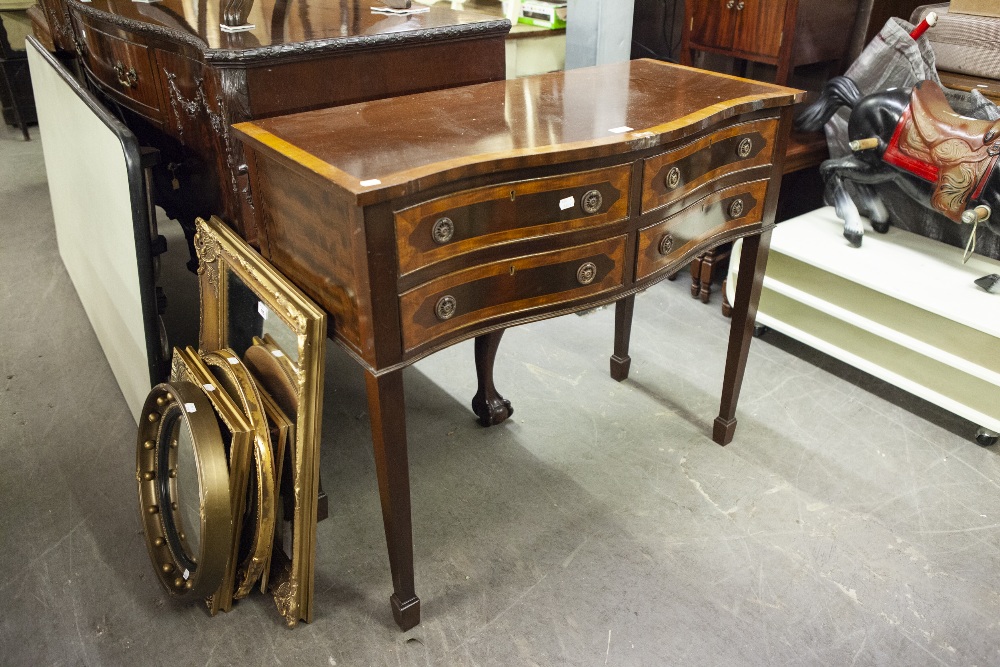 EDWARDIAN MAHOGANY SERPENTINE SIDE CABINET OF FOUR SHORT DRAWERS, ON SQUARE FLUTED SUPPORTS