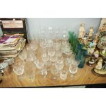 A QUANTITY OF CUT AND MOULDED STEM WINE GLASSES TO INCLUDE; CHAMPAGNE GLASSES, VARIOUS ENGRAVED