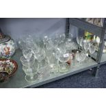 A QUANTITY OF CUT GLASS AND OTHER DRINKING GLASSES, SUNDAE DISHES AND TWO PINT TANKARDS, SALTS