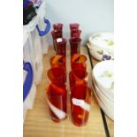 A SET OF SIX VENETIAN RUBY GLASS TALL TUMBLERS WITH WHITE SPIRAL DECORATION AND SIX VENETIAN RUBY