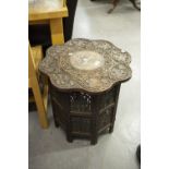 MIDDLE EASTERN CARVED AND BONE INLAID OCCASIONAL TABLE WITH POLYFOIL TOP AND PANEL SIDED