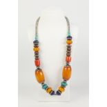 ETHNIC NECKLACE WITH LARGE AND SMALL BUTTERSCOTCH AMBER BEADS, also turquoise, red coral, metal