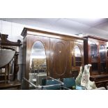 LATE NINETEENTH CENTURY INLAID OAK BEACONSFIELD TYPE WARDROBE WITH TWO OVAL MIRROR PANEL DOORS (A.