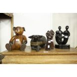 FIVE MODERN CARVED HARDWOOD ORNAMENTS, INCLUDING; EBONISED WOOD FAMILY CIRCLE, RECUMBENT OXEN, TEDDY