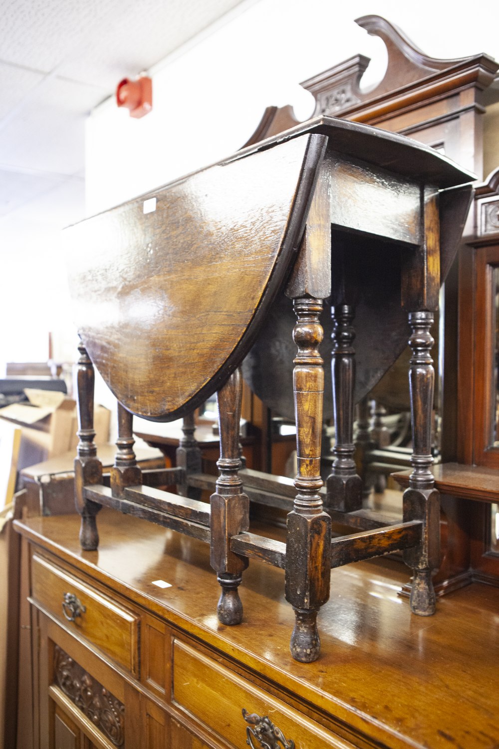 AN OAK OVAL GATE DINING TABLE, ON TURNED BALUSTER LEGS, 2'10" wide, 4' long