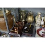 A BRASS WATER JUG, ELECTROPLATE PIERCED BOTTLE STAND, THREE COPPER 'RUM' MEASURES, HENNESSEY