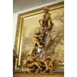 ORIENTAL HARDWOOD GROUP, CARVED IN A EUROPEAN FLAVOUR WITH TWO BOYS CLIMBING A GNARLED TREE STUMP TO