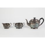 LLOYD, PAYNE & AMIEL THREE PIECE ELECTROPLATED TEASET, of oval form with black scroll handle,