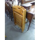 A TEAK FRAMED WALL MIRROR AND FOUR FOLDING CHAIRS