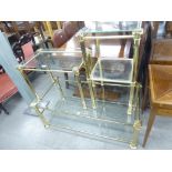 A BRASS AND GLASS OBLONG COFFEE TABLE, AND MATCHING SMALLER TABLE AND A TWO TIER TABLE (3)