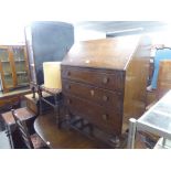 OAK BUREAU HAVING THREE DRAWERS, FALL FRONT ON ON BULBOUS FRONT SUPPORTS