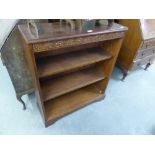A SMALL CARVED OAK OPEN BOOKCASE