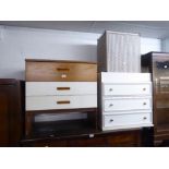 A TEAK AND WHITE FINISH CHEST OF THREE LONG DRAWERS; A WHITE MELAMINE CHEST OF THREE LONG DRAWERS