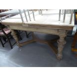 VICTORIAN OAK EXTENDING DINING TABLE, THE PULL-OUT TOP ON TURNED SUPPORTS WITH 'Y' STRETCHER