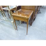 AN EDWARDIAN INLAID MAHOGANY ENVELOPE FOLDING CARD TABLE WITH DRAWER, ON TAPERING LEGS