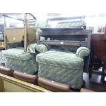 A PAIR OF MANUAL RECLINING LOUNGE CHAIRS, IN GREEN VELVET AND A BOX STOOL UPHOLSTERED TO MATCH