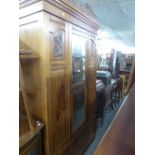 A VICTORIAN WALNUT MIRROR DOOR WARDROBE WITH DRAWER BELOW