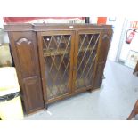 OAK SUPERSTRUCTURE BOOKCASE WITH GLAZED LATTICE CENTRAL DOORS FLANKED BY TWO PANEL DOORS (AS FOUND)