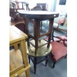 AN EDWARDIAN OAK DISPLAY STAND WITH ROUNDED HAMMERED PEWTER TOP AND ANOTHER SIMILAR WITH MIDDLE