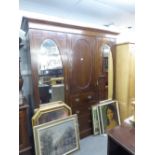 LATE NINETEENTH CENTURY INLAID OAK BEACONSFIELD TYPE WARDROBE WITH TWO OVAL MIRROR PANEL DOORS (A.