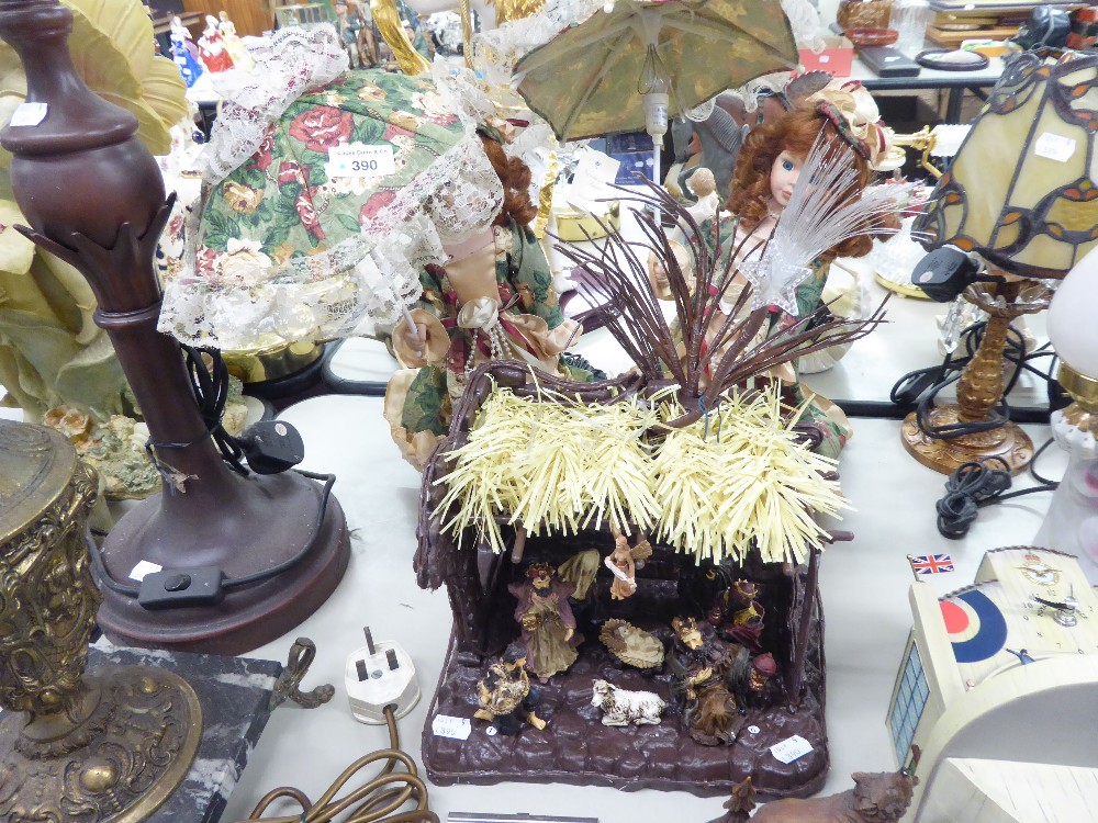 PAIR OF BISQUE HEADED FASHION DOLLS, EACH HOLDING A PARASOL PATTERN LAMP AND AN ELECTRICALLY