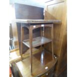 CIRCA 1920's OAK OCCASIONAL TABLE, WITH SWIVEL AND FLAP CARD TABLE TOP AND A SEWING MACHINE, IN CASE