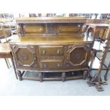 AN EARLY TWENTIETH CENTURY OAK JACOBEAN STYLE DINING ROOM SUITE, COMPRISING; SIDEBOARD, EXTENDING