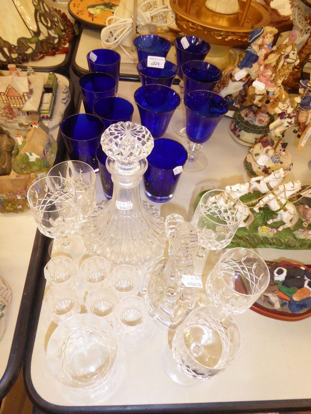 A SET OF SIX WINE GOBLETS WITH BLUE GLASS BOWLS; SIX MATCHING TUMBLERS; A GLASS SHIP'S DECANTER; A