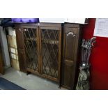 OAK SUPERSTRUCTURE BOOKCASE WITH GLAZED LATTICE CENTRAL DOORS FLANKED BY TWO PANEL DOORS (AS FOUND)