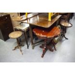 A NEST OF THREE MAHOGANY COFFEE TABLES WITH INLET LEATHER TOP, FALL ENDS, TWO DRAWERS