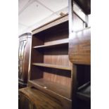 A SMALL CARVED OAK OPEN BOOKCASE