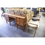 A MATCHING ORIENTAL FLAVOUR KNEEHOLE DESK AND TWO OPEN ARMCHAIRS