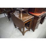 MAHOGANY DROP-LEAF DINING TABLE, AN OAK TEA TROLLEY; ANOTHER TEA TROLLEY