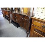 VICTORIAN MAHOGANY SERPENTINE SIDEBOARD, TWO CUPBOARDS TO EITHER END WITH TWO CENTRAL GRADUATED