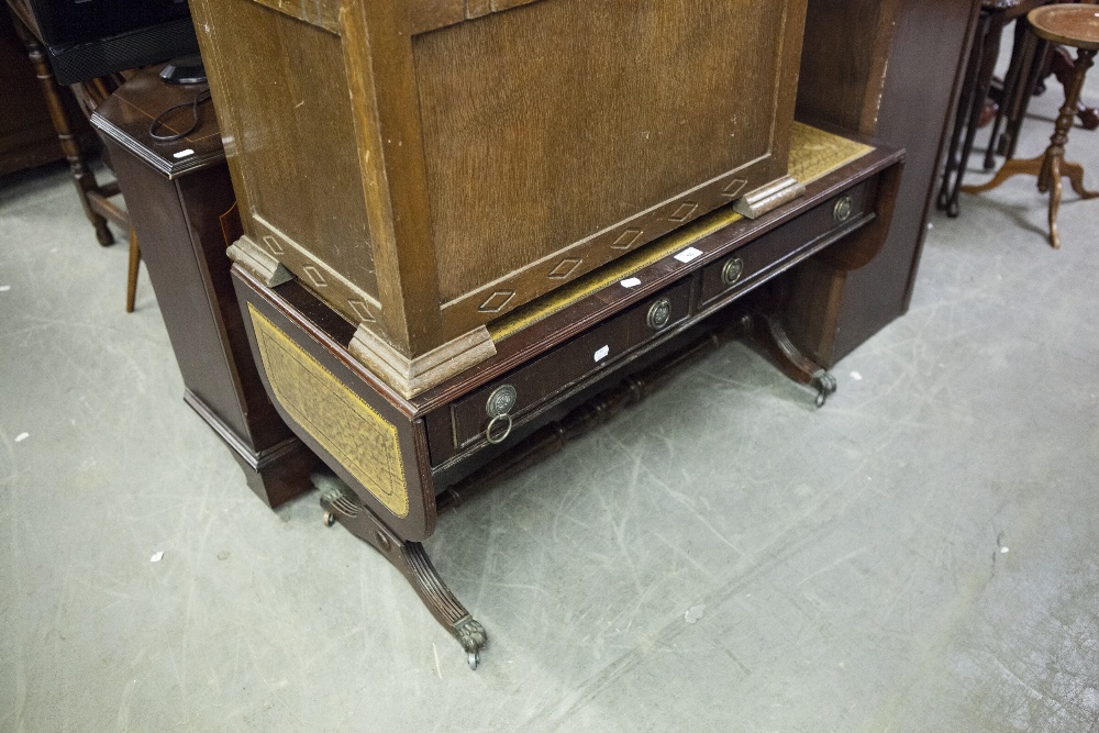 A MAHOGANY REGENCY STYLE SOFA STYLE LOW OCCASIONAL TABLE, WITH INLET LEATHER TOP, FALL ENDS WITH TWO