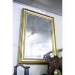 A GILT FAMED OBLONG WALL MIRROR