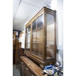 A MAHOGANY CHINA DISPLAY CABINET HAVING TWO GLAZED DOORS ON CABRIOLE SUPPORTS